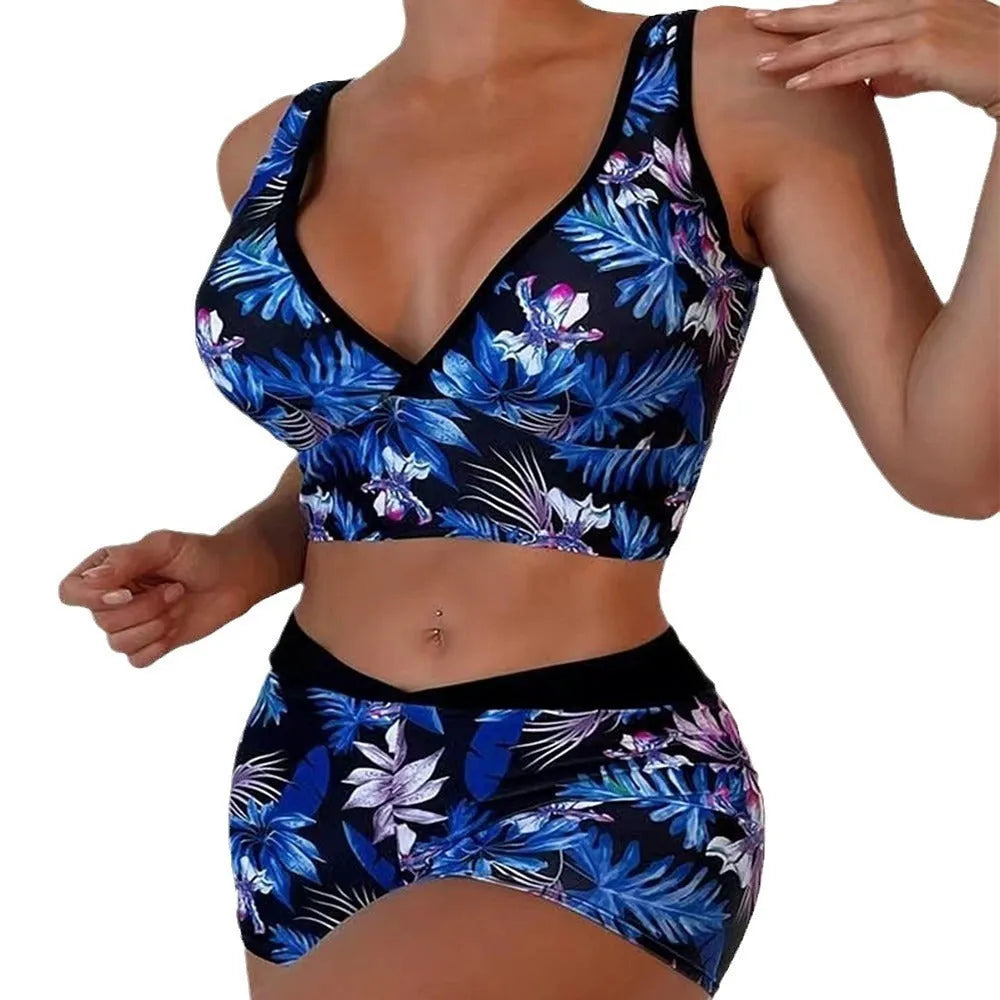 Women's two-piece printed boxer swimsuit set in a multi-colour pattern, showing sleeveless top and briefs.