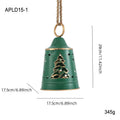 Wrought iron Christmas bell ornament in red, green, and white with hanging loop on a white background