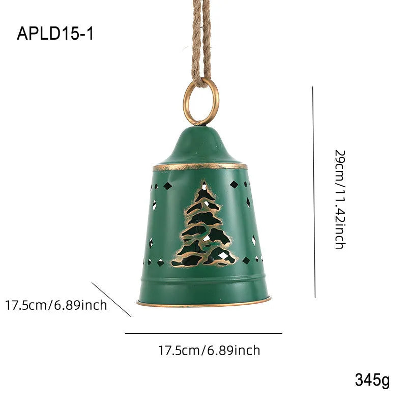 Wrought iron Christmas bell ornament in red, green, and white with hanging loop on a white background