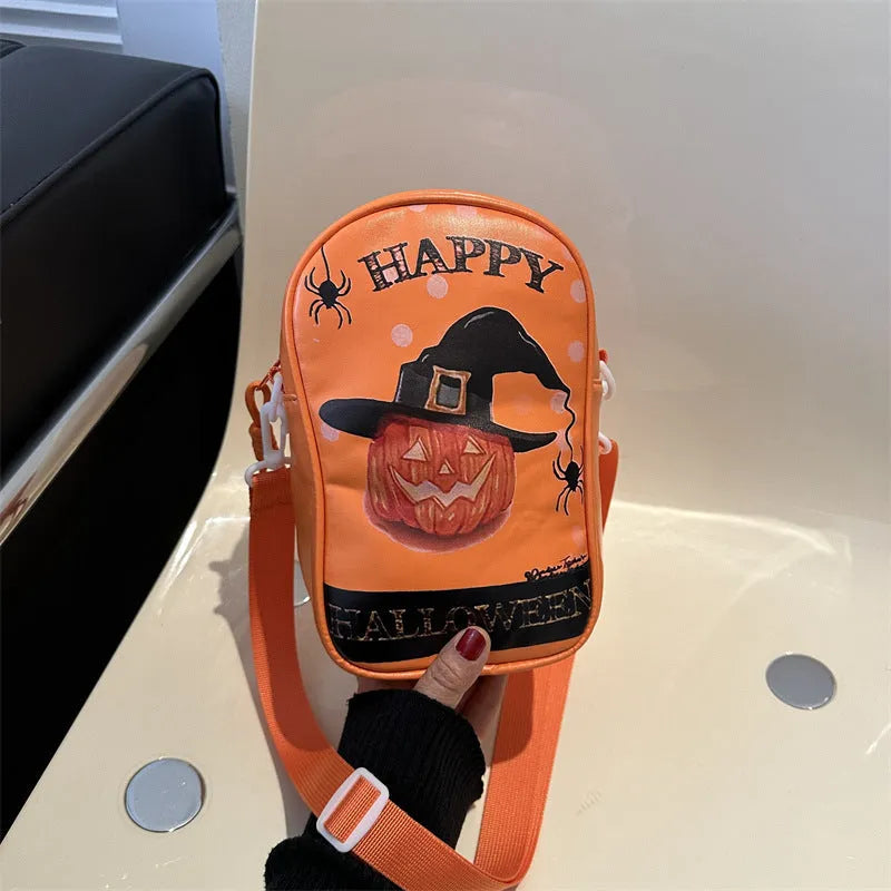 Halloween graffiti print crossbody phone bag with cartoon pumpkins, in multiple colours.