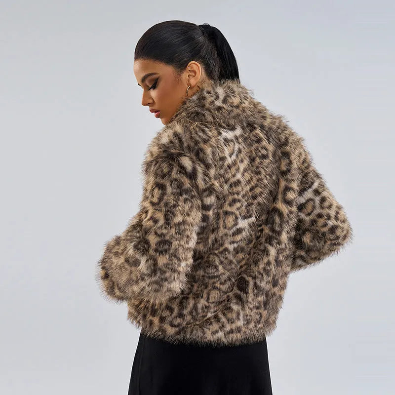 Women's leopard print coat with buckle lapel fastening on a hanger