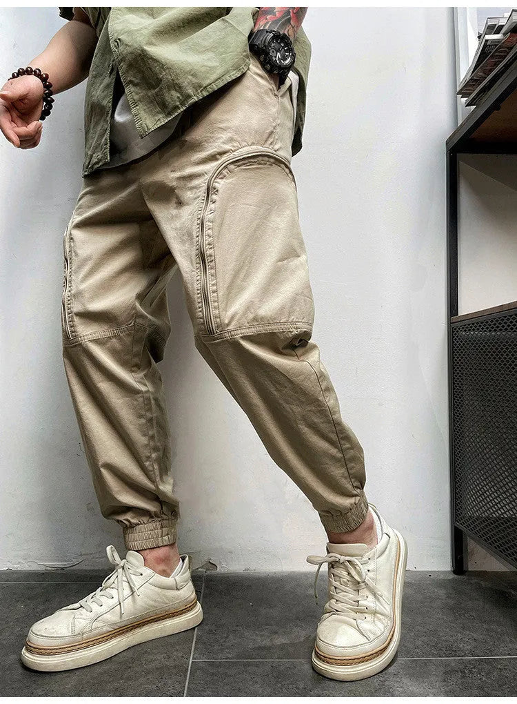 Men's loose fit cotton cargo trousers with elastic waist and zipper pockets in army green