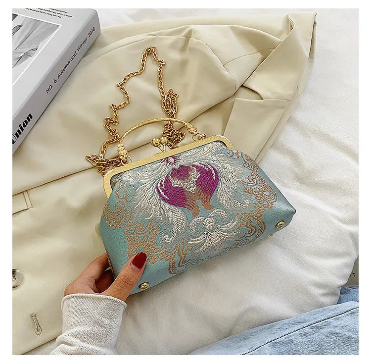 Chinese embroidery cheongsam handbag in polyester with shell shape and internal zipper compartment