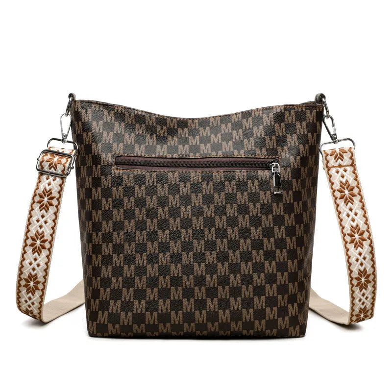 PU dumpling shape shoulder bag in black showing structured design with sandwich pocket