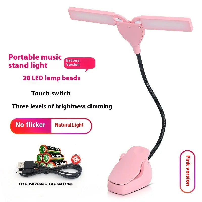 Black rechargeable music stand lamp with 28 LEDs and USB cable on a music stand.