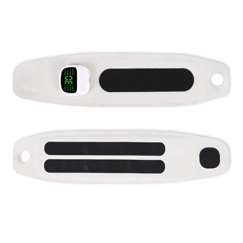 Adjustable hand massage instrument with coloured wristbands on a table.