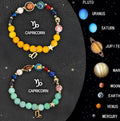 Set of twelve natural stone beaded bracelets arranged in a circle, each featuring a different zodiac sign style.