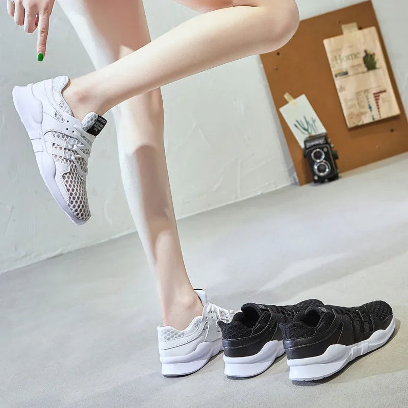 Men's breathable mesh sneakers with hollow-out design and flat EVA sole in black and white colour options