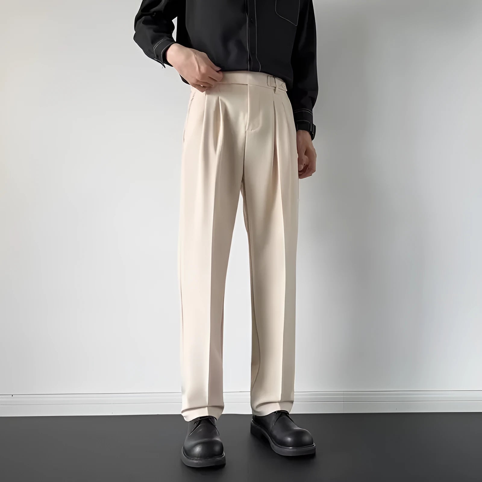 Men's straight cut loose fitting suit trousers in black and apricot colours