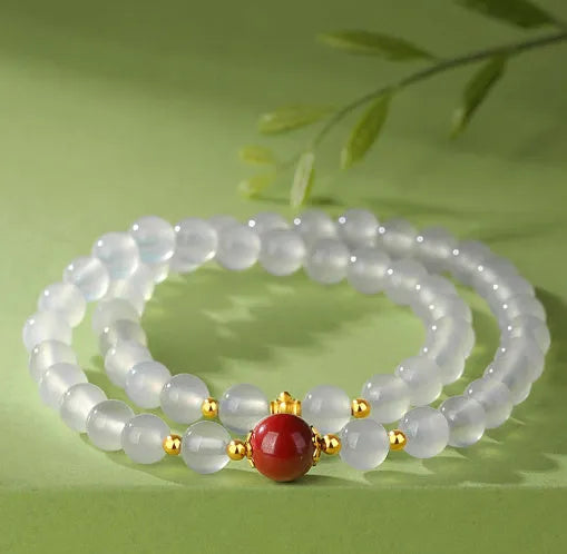 Women's white agate bracelet with cinnabar accents featuring 6mm geometry beads in double layer design