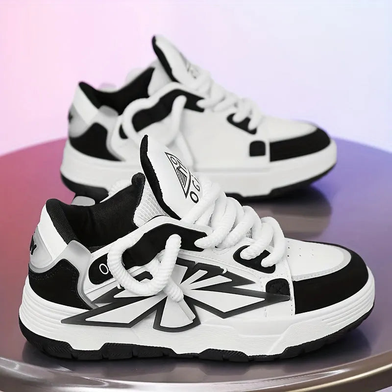Men's white clunky casual sneakers with cartoon totem pattern, round toe, and lace-up front on a rubber sole.