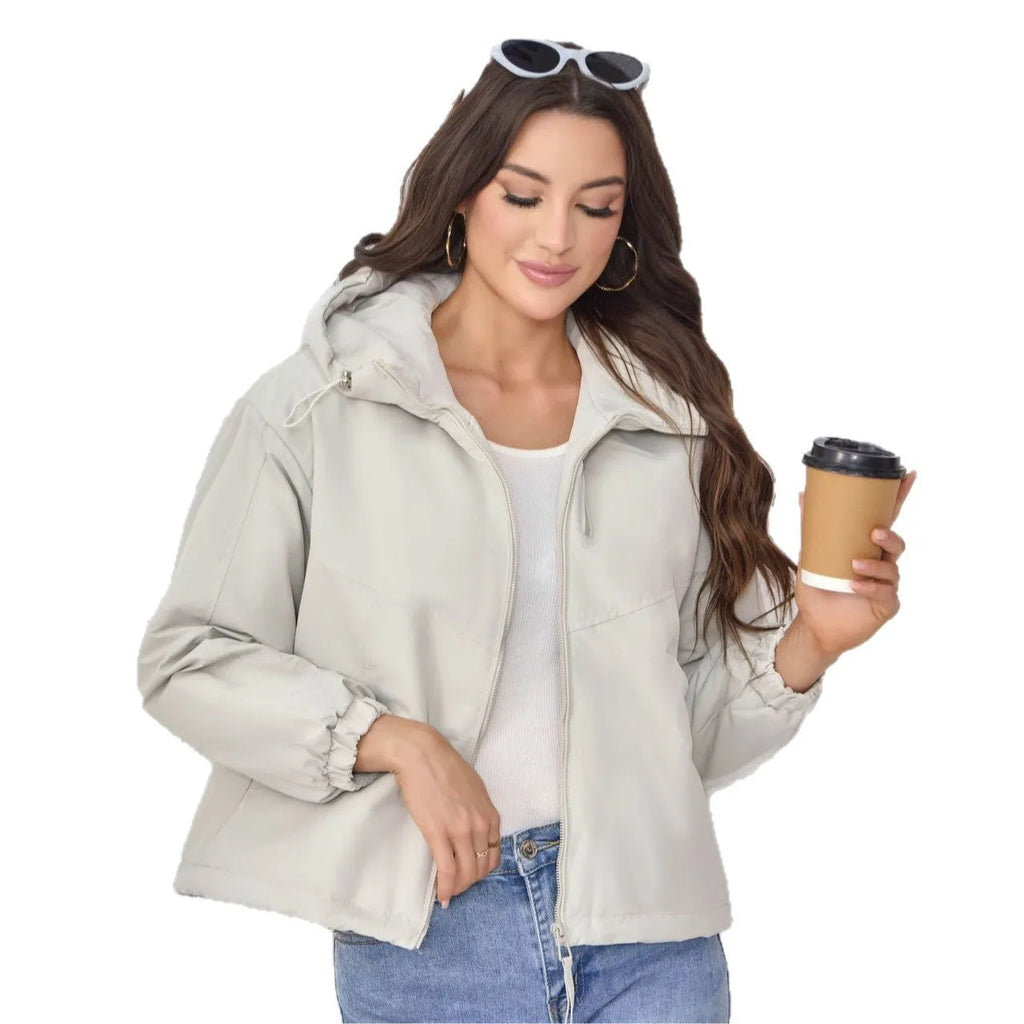 Women's grey loose-fit hooded polyester shell jacket with long sleeves.