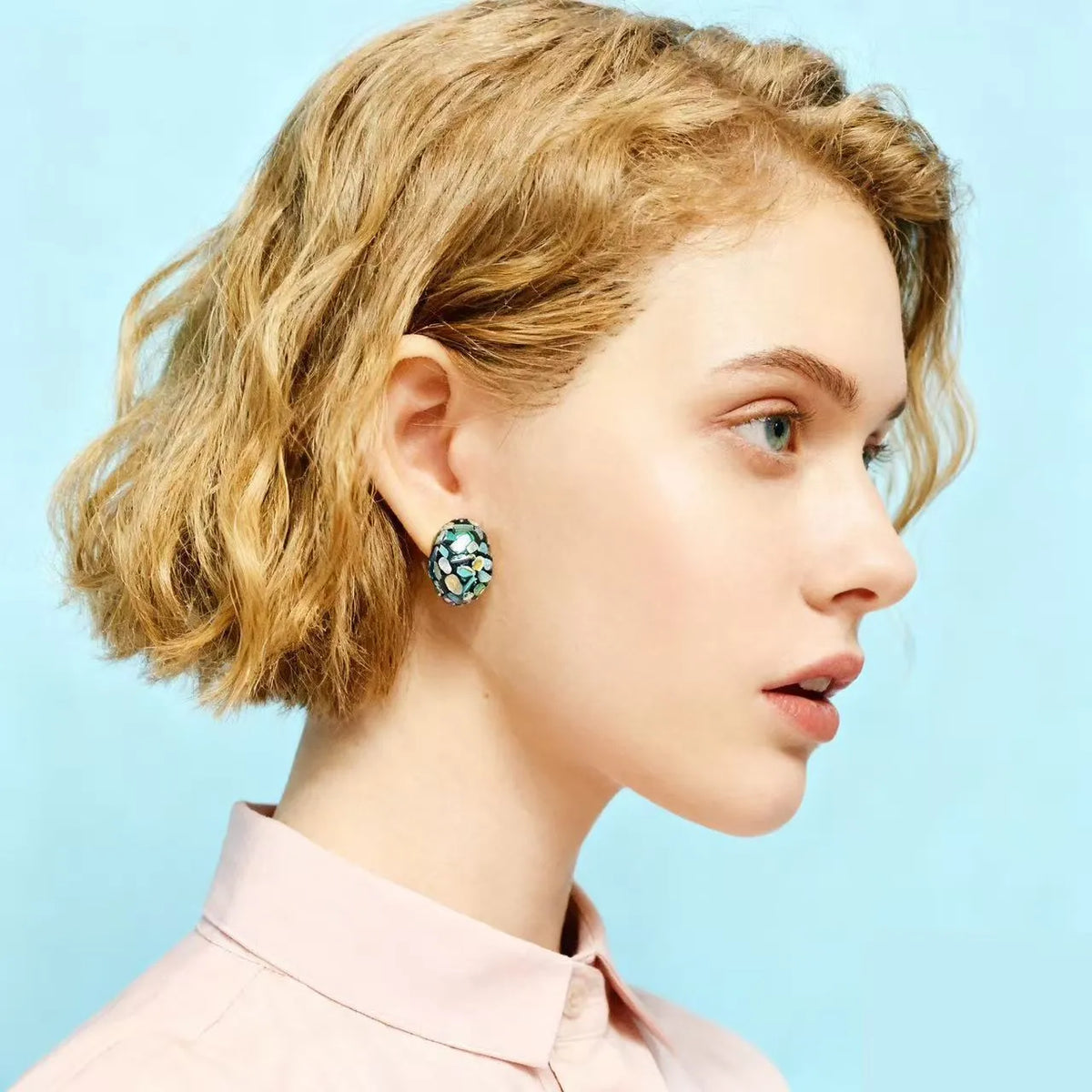 Lacquer rhinoceros skin bead and pearl stud earrings with Chinese character 'Fu' motif in geometric abstract shape, mother-of-pearl colour
