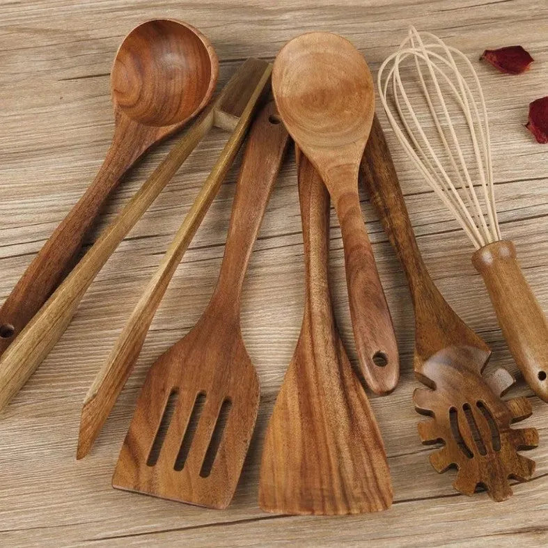 Wooden cooking utensil set with seven different kitchen tools including spoon and shovel