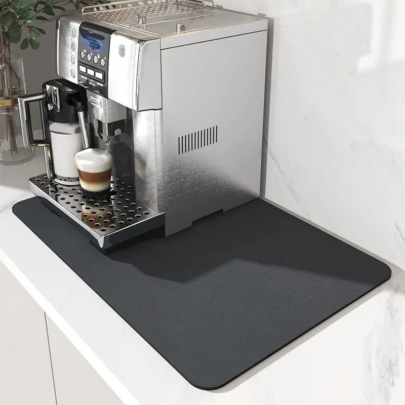 Black super absorbent square rubber drain pad mat on a kitchen countertop
