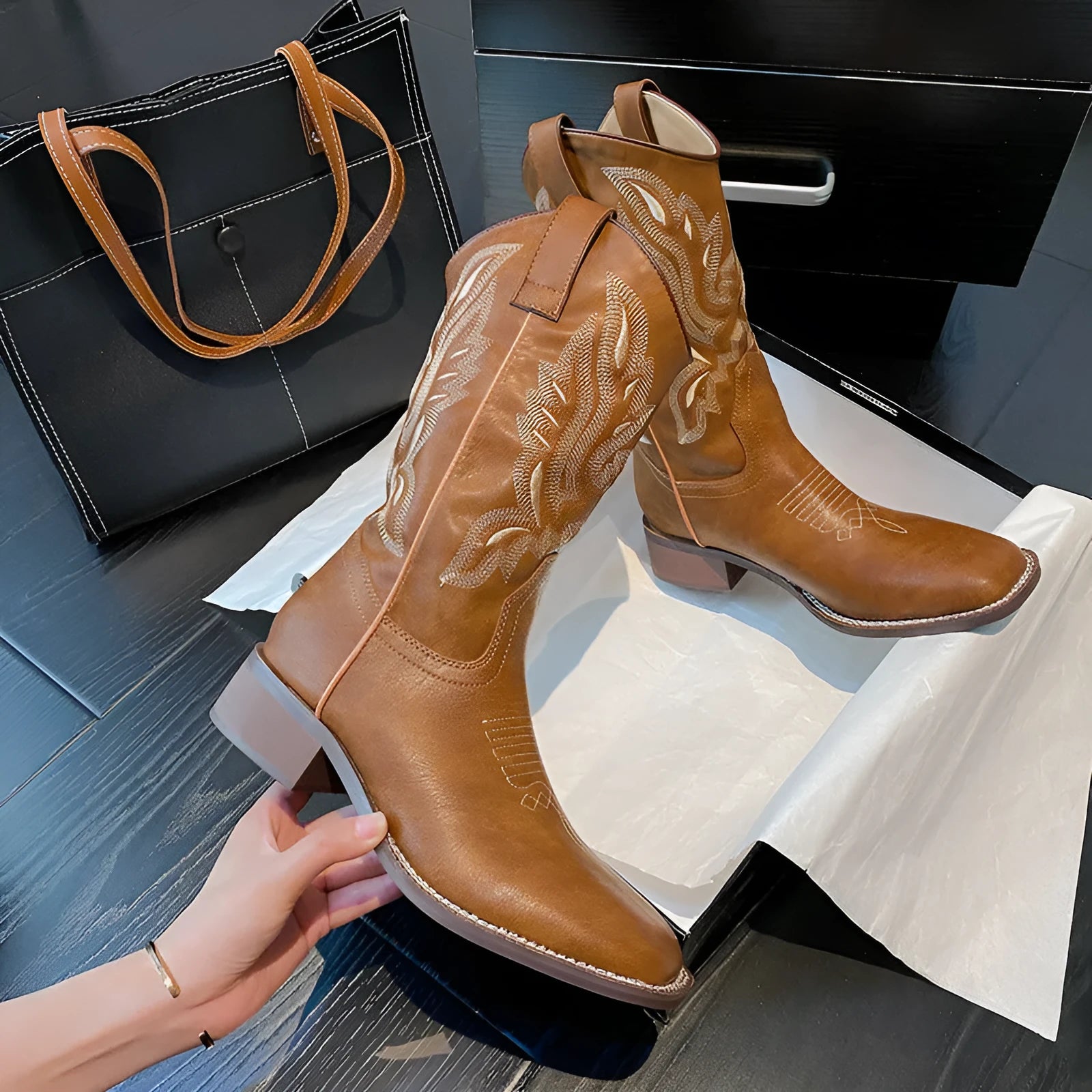 Brown women's mid-calf Martin boots with embroidery detailing and waterproof platform