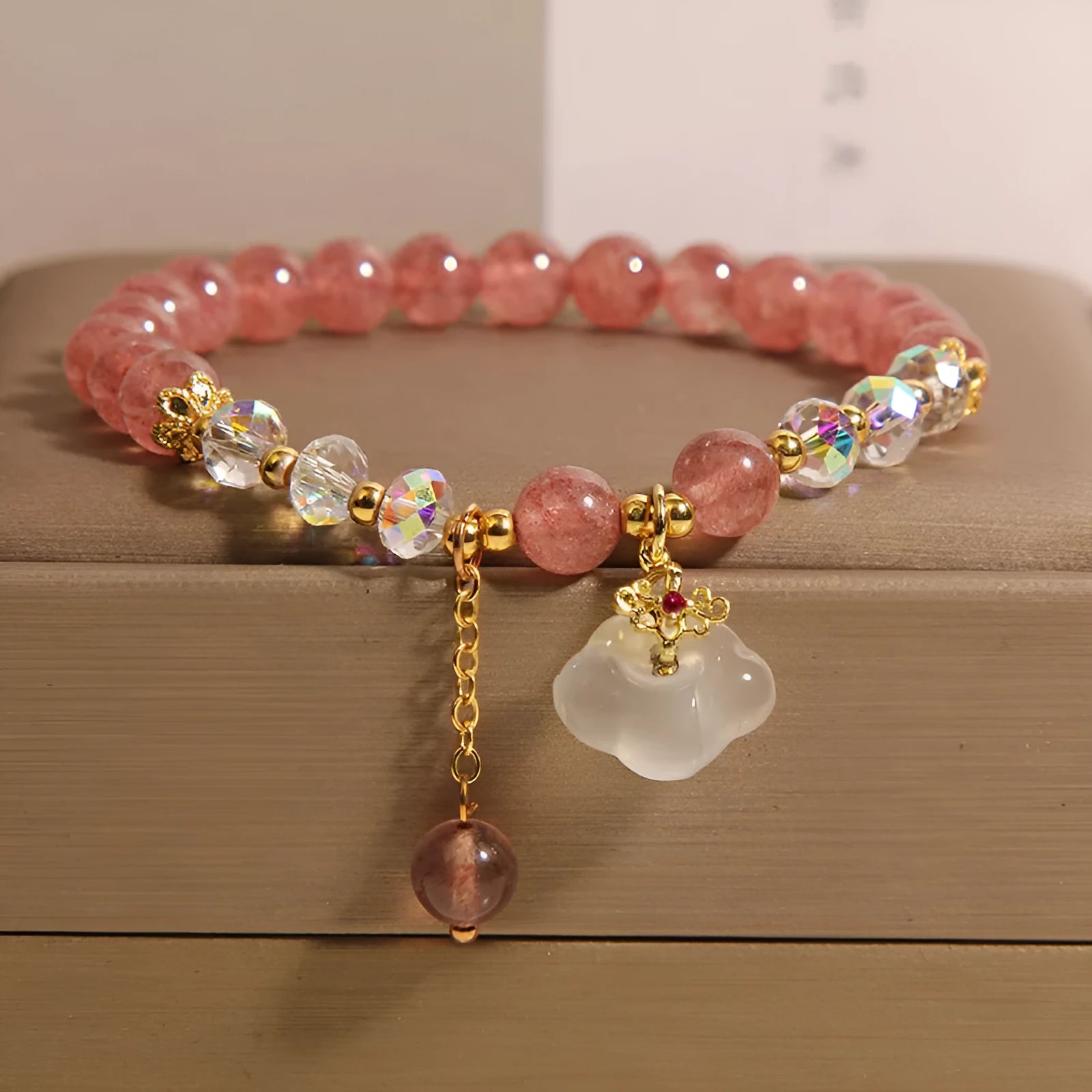 Women's strawberry quartz and white agate crystal bracelet with auspicious cloud design