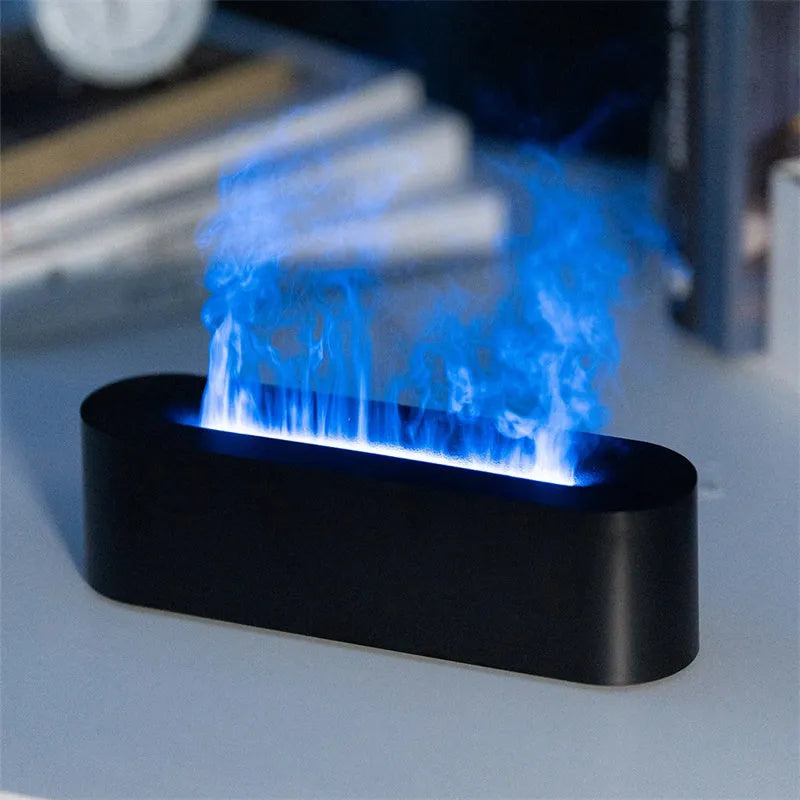 White square ultrasonic flame aroma diffuser and humidifier with LED light on a table.
