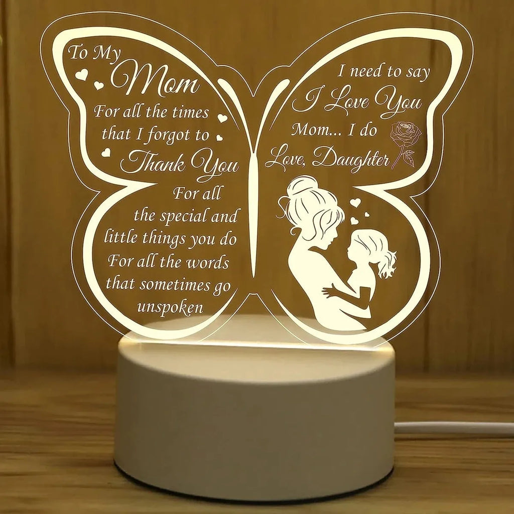 White heart-shaped acrylic table lamp with touch switch on a wooden surface.