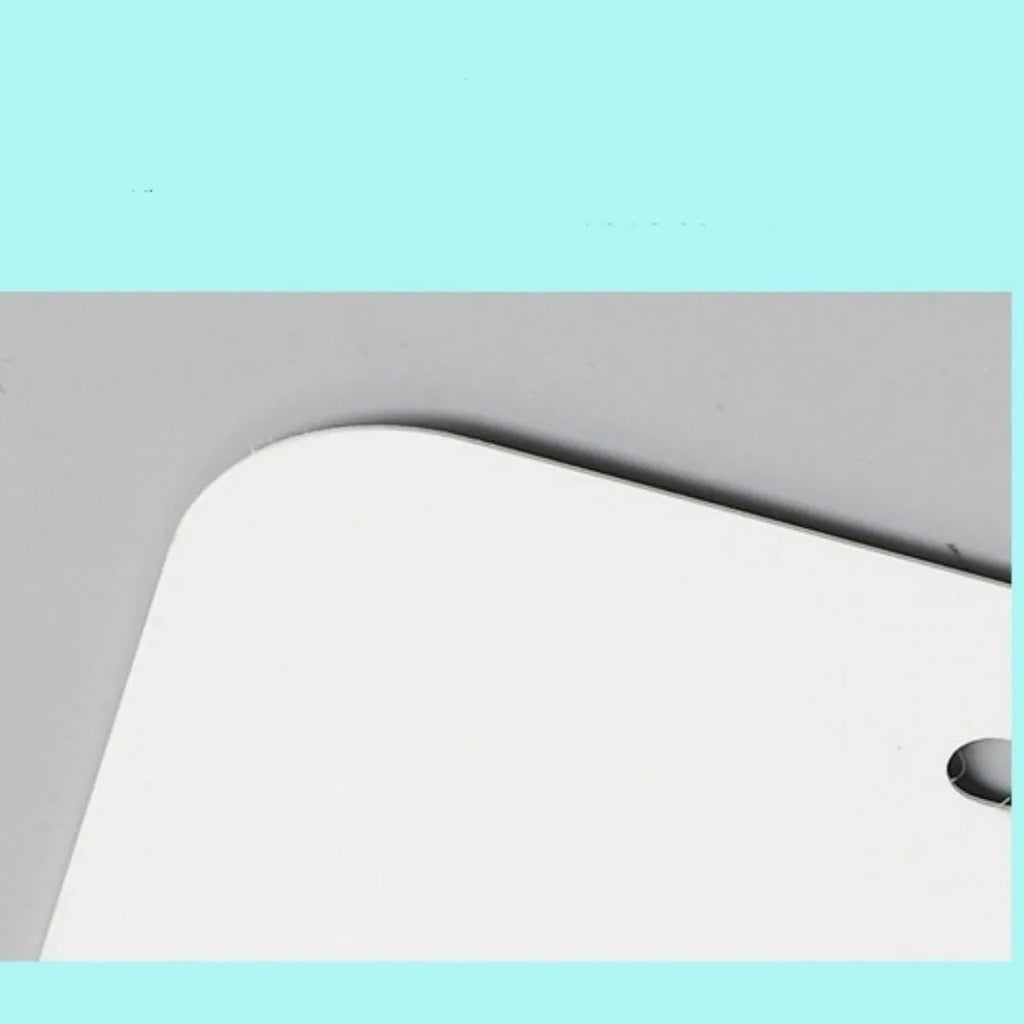 A white rectangular aluminium sheet blank for making a car licence plate, showing size and thickness options.