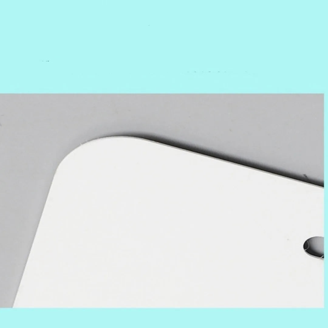 A white rectangular aluminium sheet blank for making a car licence plate, showing size and thickness options.