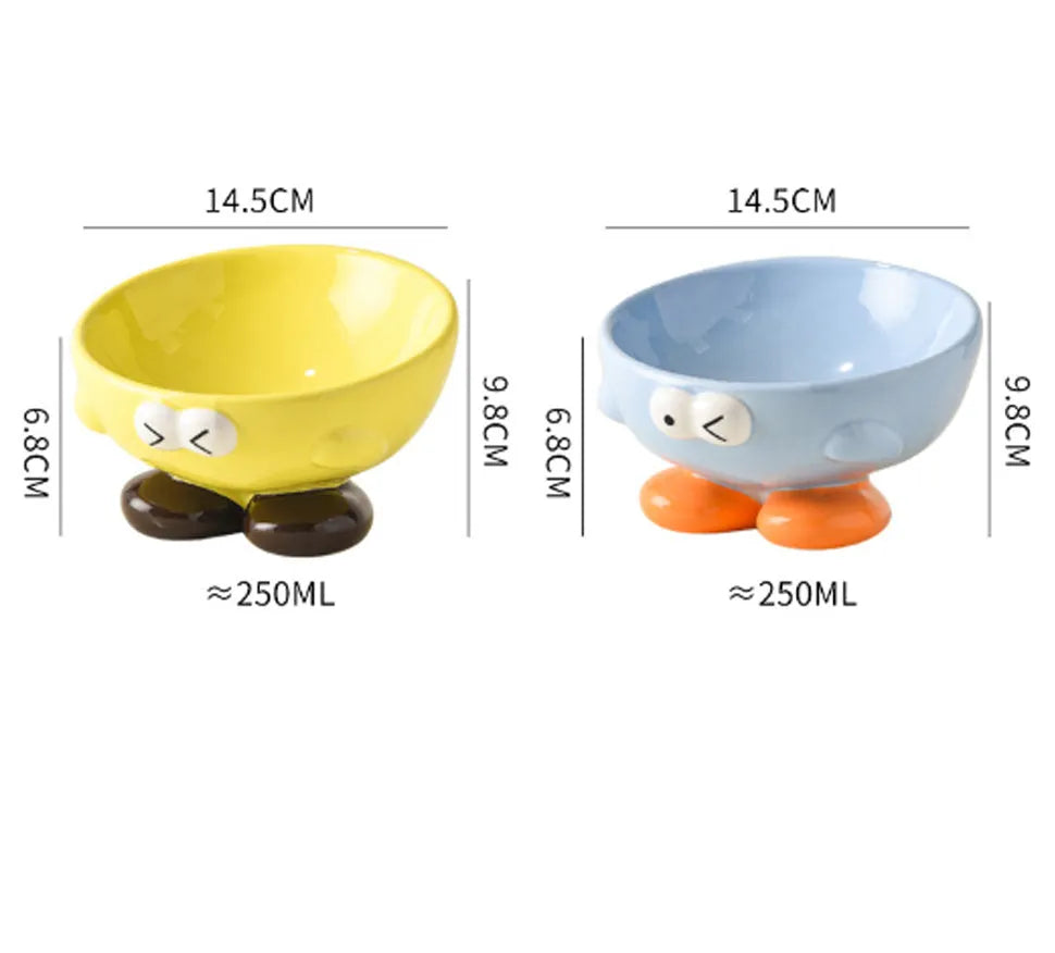 Tall blue ceramic slanted pet bowl with cute expression, designed for cervical spine support.