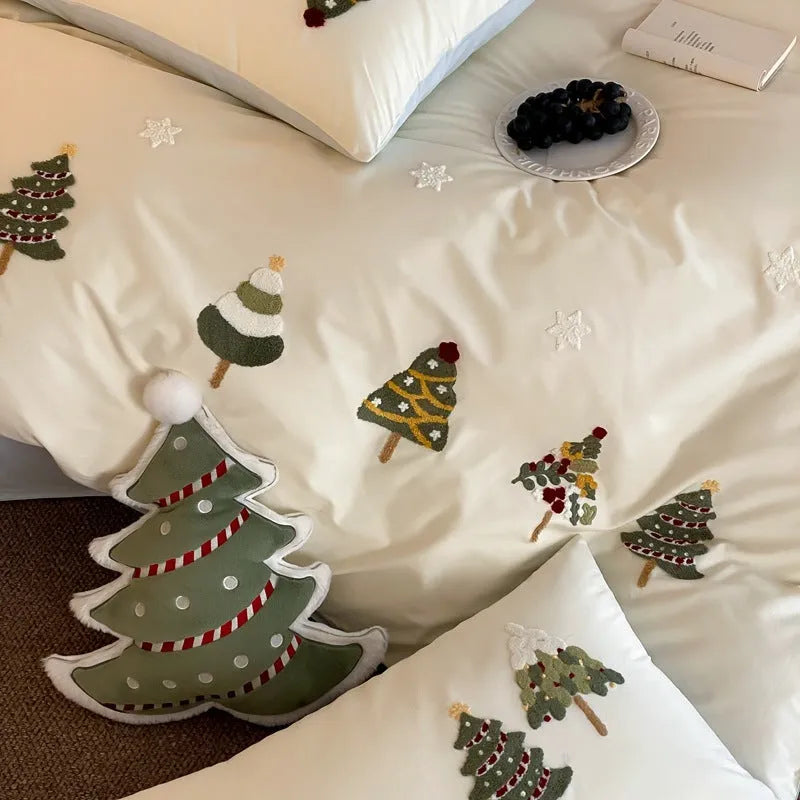 Pure cotton four-piece bed set with embroidered Christmas tree pattern in cream blue and green colours.