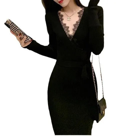 Black slim fit wool skirt dress with a princess A-line silhouette on a hanger.