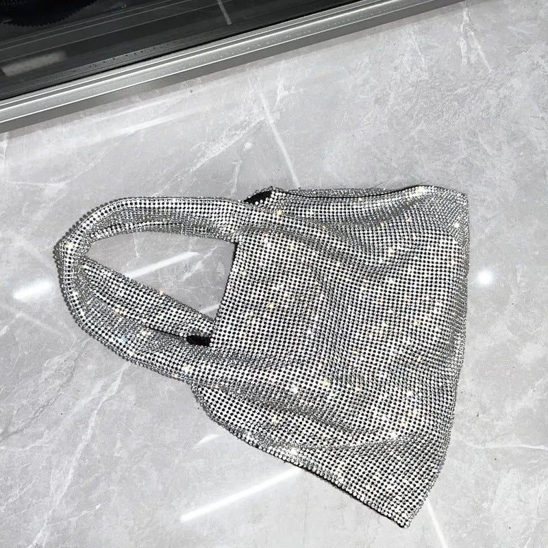 Silver ladies handbag with rhinestone embellishment on cotton thread construction and open outer pocket