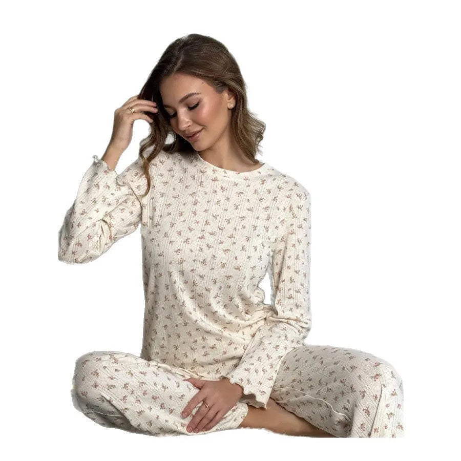 Women's white floral print bell sleeve round neck top and wide leg pants loungewear suit on model