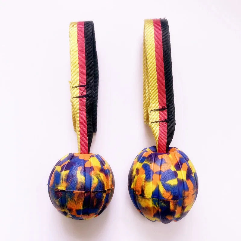 Floating EVA pet training ball in yellow and camouflage colours showing three diameter sizes for water fetch