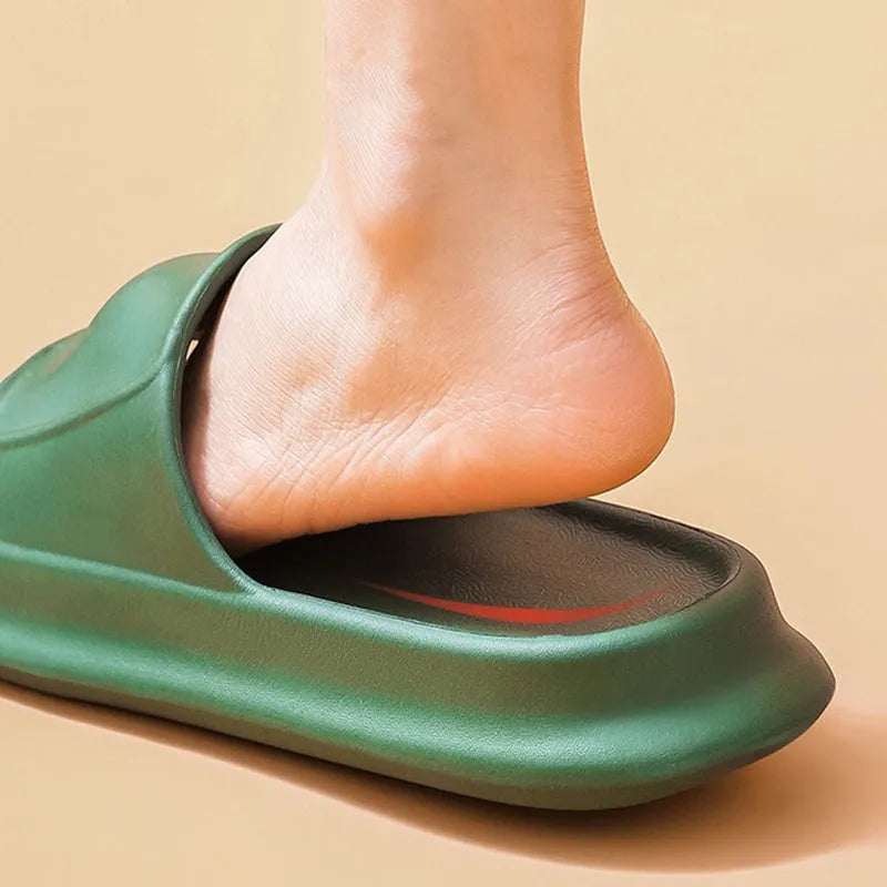 Pair of thick-soled EVA flip-flop slippers in a choice of seven colours, shown on a wet bathroom floor.