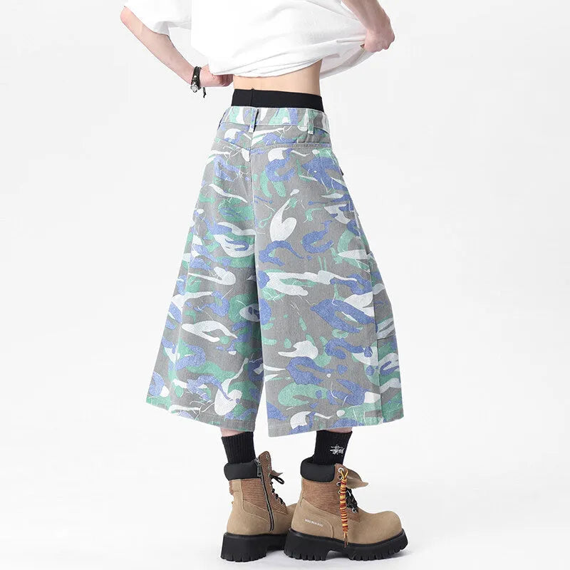 Cropped camouflage denim work trousers with straight leg cut and zipper fly closure