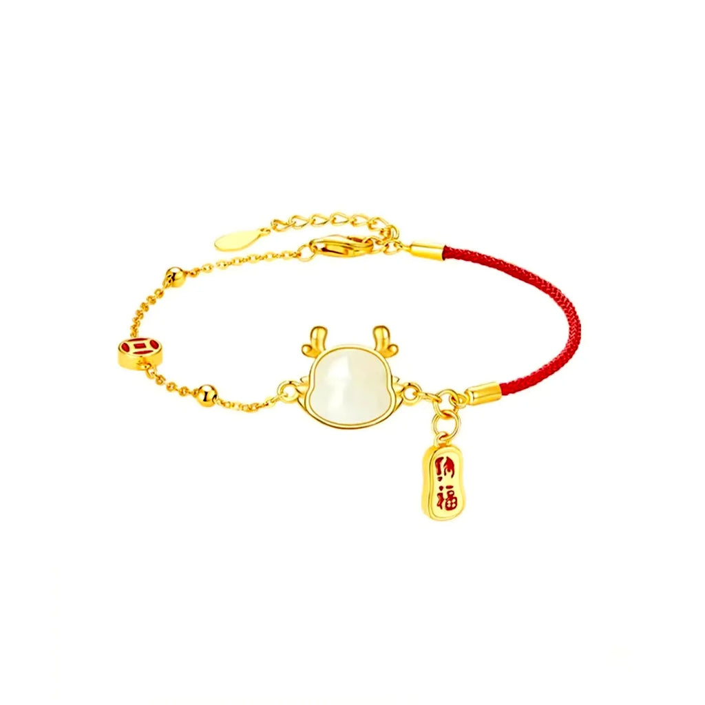 Silver-plated copper bracelet with a dragon zodiac pendant on a wrist.