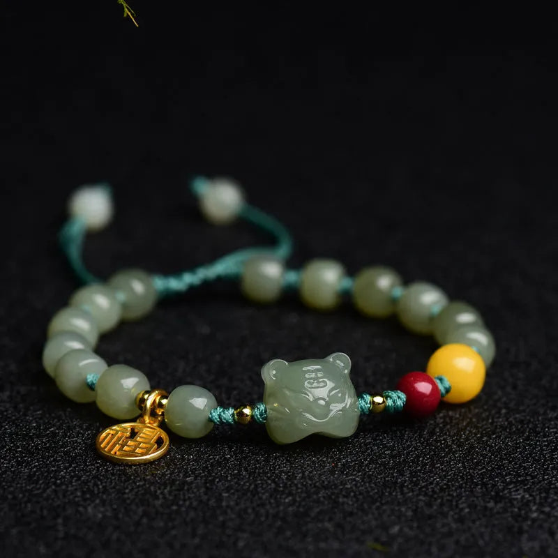 Natural Hetian jade bracelet with cinnabar and beeswax beads featuring animal modelling