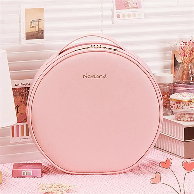 Round smart LED makeup bag with integrated mirror lights in cherry blossom pink colour with lattice partitions visible