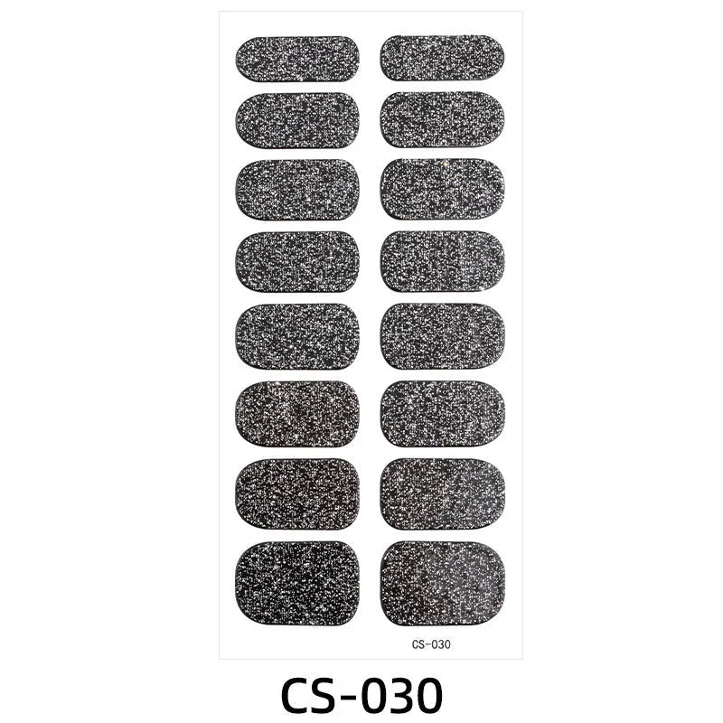 Assorted nail sticker designs including cartoon, love heart, and starry sky patterns on bare clip-on nails with a nail file