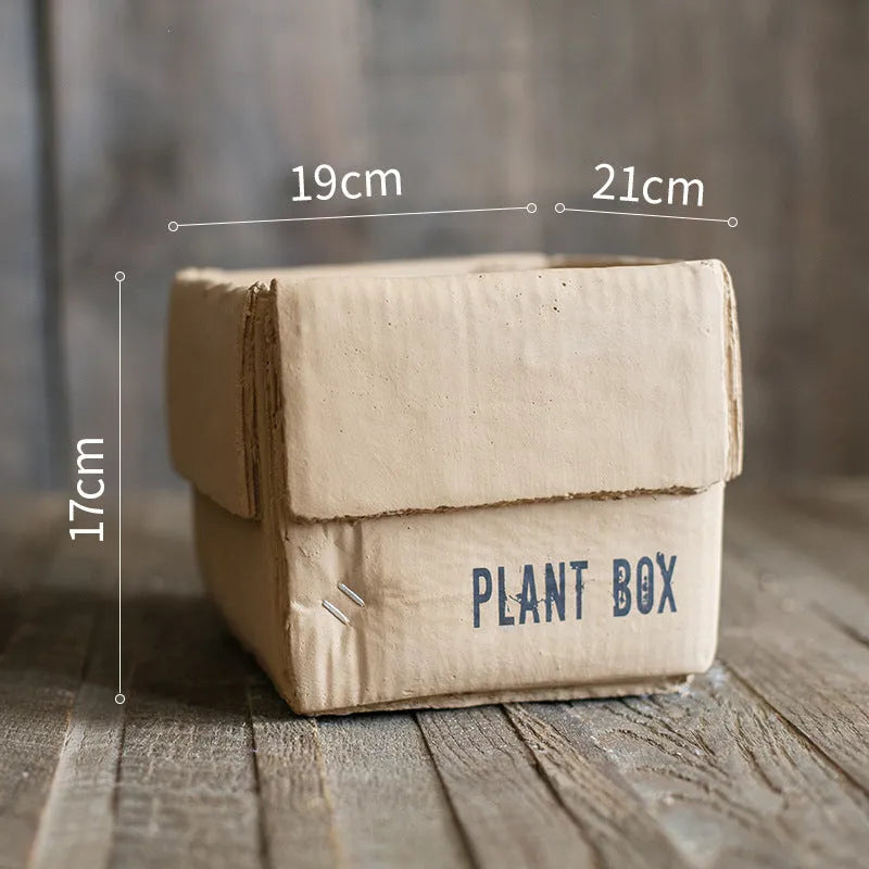 Cement flowerpot with perforated base and Nordic brown paper box design