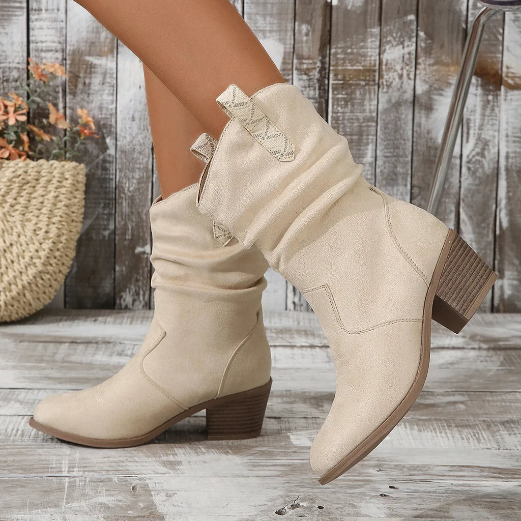 Women's suede mid heel boots in milky white colour with a calf-length design and rubber sole.