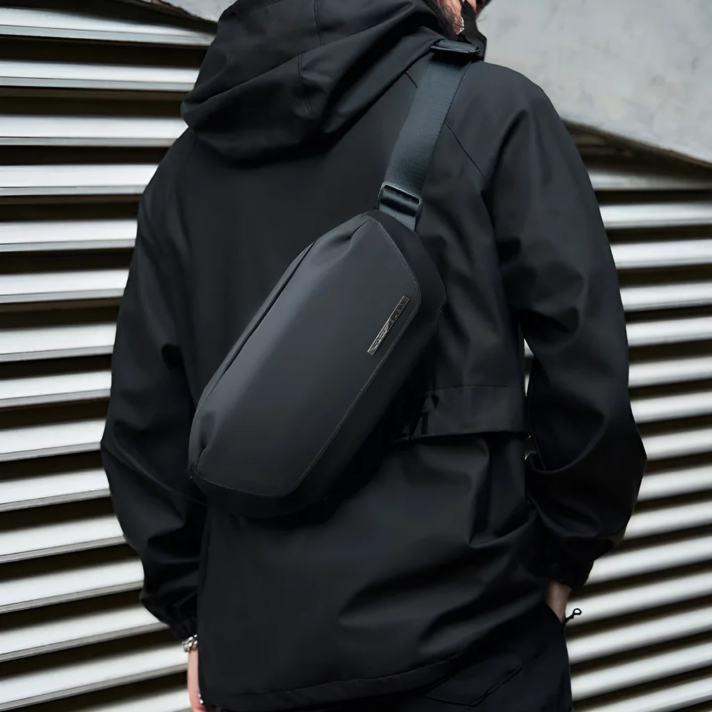 Black Oxford cloth messenger bag with one-shoulder design and street style details