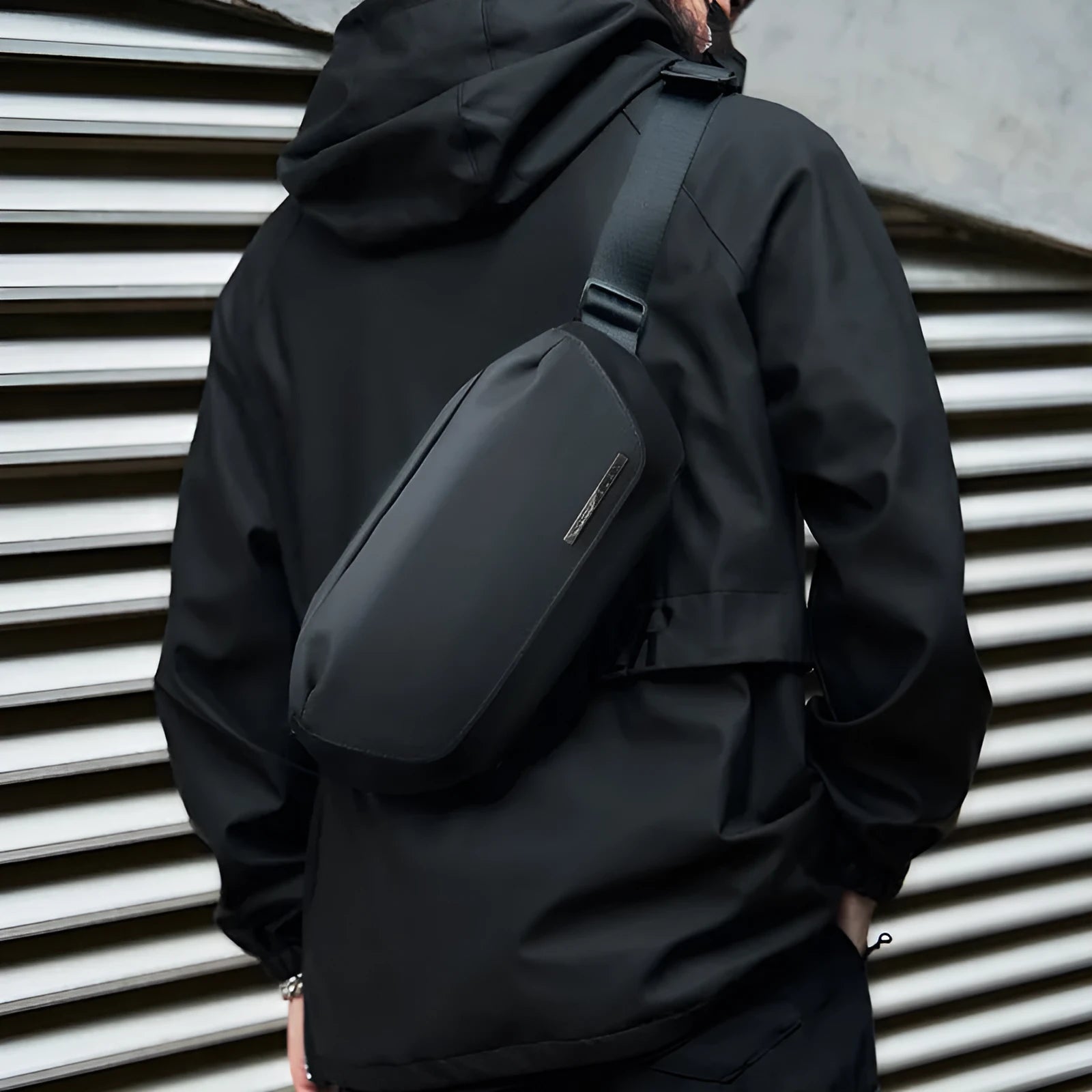 Black Oxford cloth messenger bag with one-shoulder design and street style details