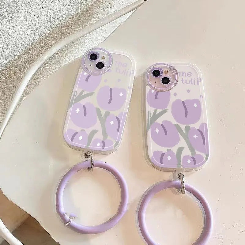 Purple transparent iPhone case with ring holder and tulip heart pattern, includes matching wrist strap