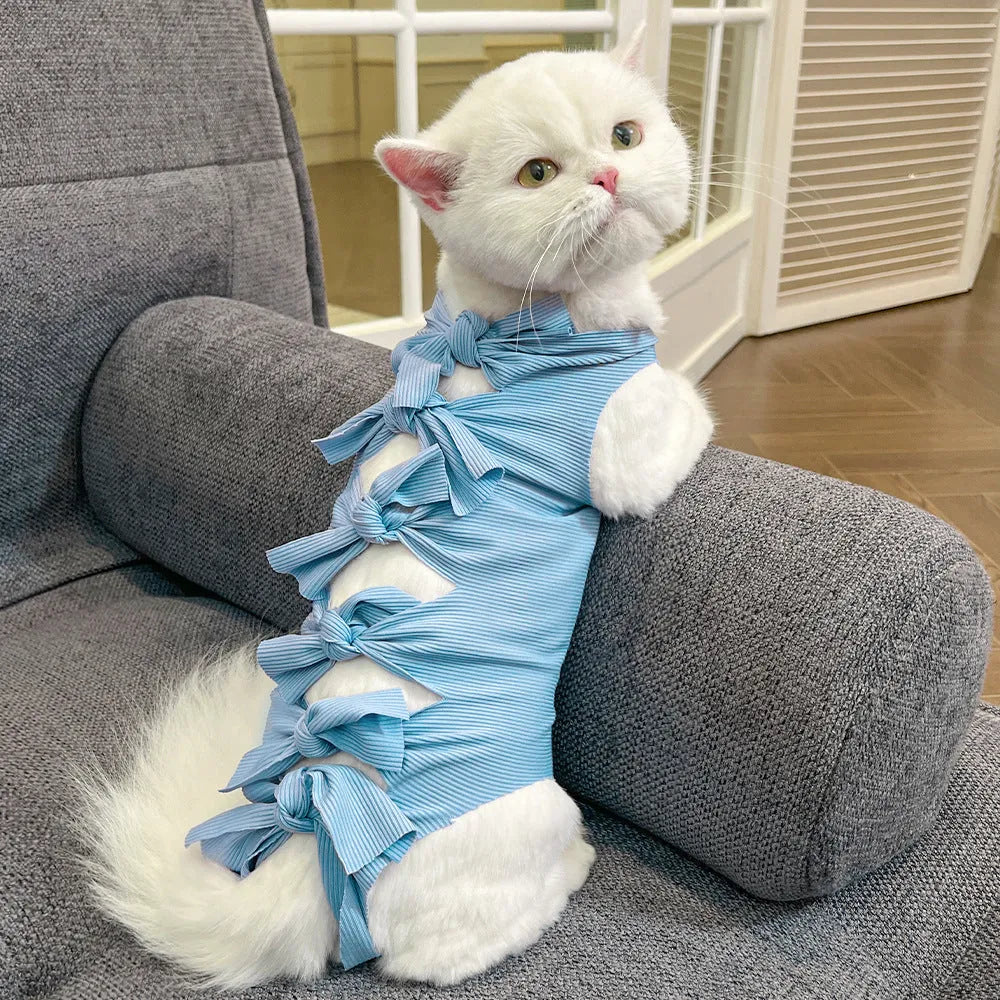 Blue lace-up polyester sterilisation clothing for a cat, shown on a size chart for S, M, and L.