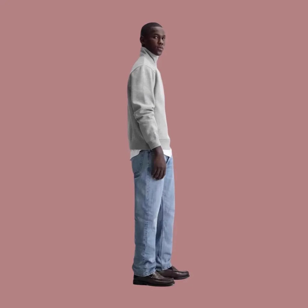 Grey unisex half-zip stand collar cotton sweater on a hanger.