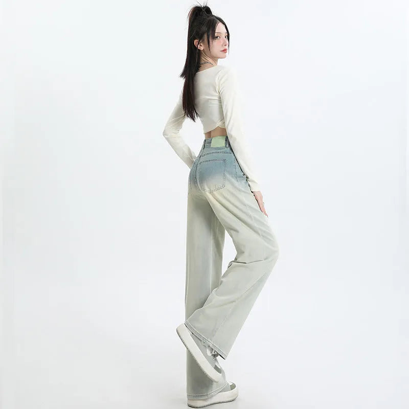 Women's gradient blue straight-leg denim trousers with wide leg style on hanger