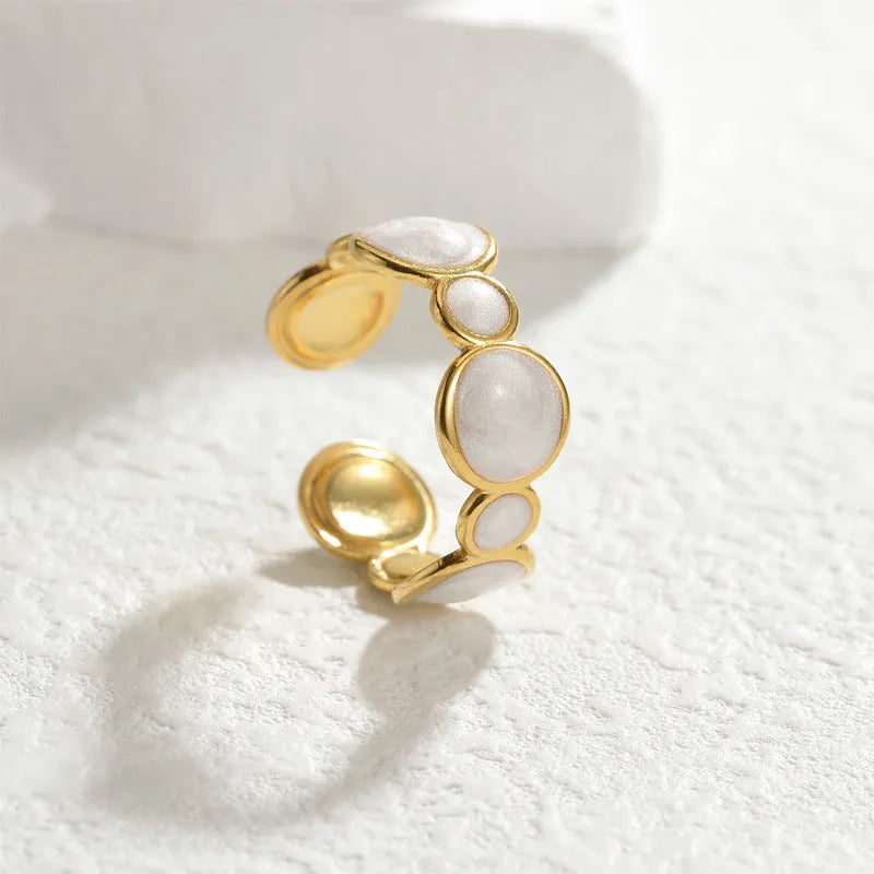 Geometric stainless steel ring with adjustable opening and electroplated metallic finish