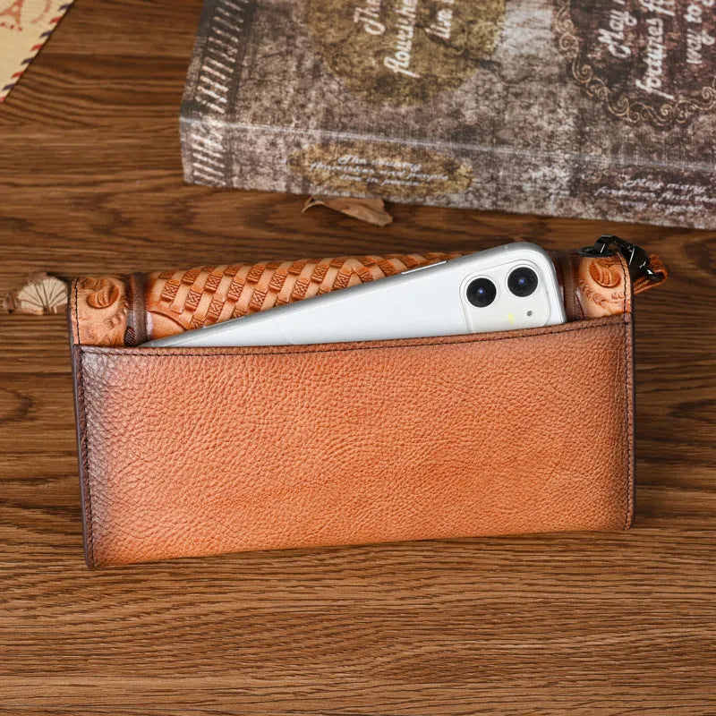 Vintage brown floral embossed women's tri-fold leather wallet showing interior organisation