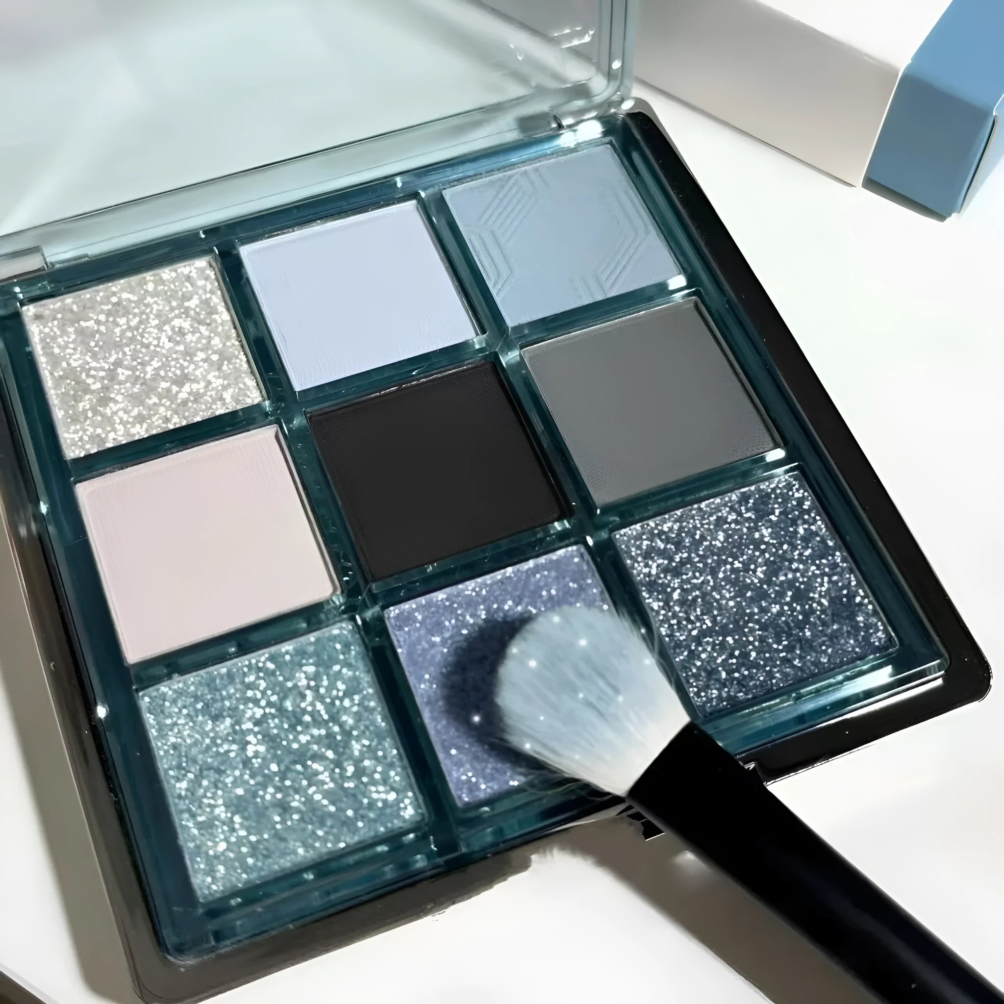 MUGELEEN 08 nine-colour eye shadow palette showing blue smoked tones with matte and shimmer finishes