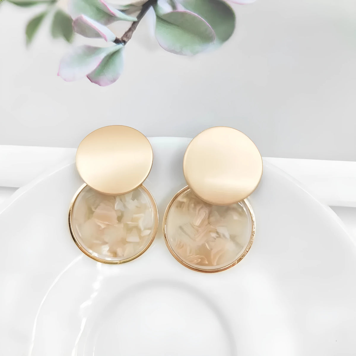 Round matte resin female earrings with retro design and smooth surface for casual wear.