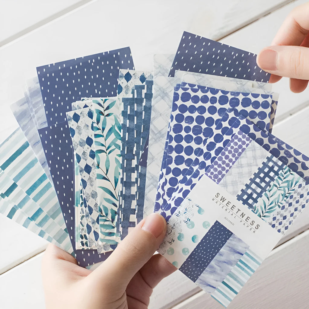 Pack of 50 retro collage material note papers in dessert colours like red plum and caramel, each sheet 56mm by 83mm.